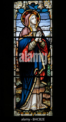 Ein Glasfenster, die Darstellung der Jungfrau Maria an die Kreuzigung Christi, über Silton Kirche, North Yorkshire Stockfoto