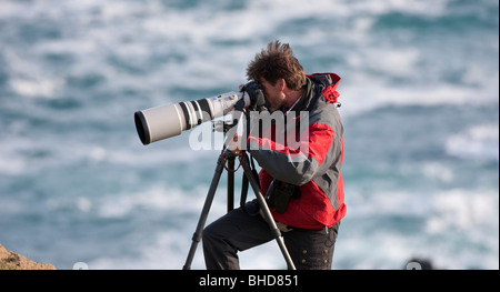 Fotograf mit Teleobjektiv, Snaefellsnes Halbinsel, Island Stockfoto