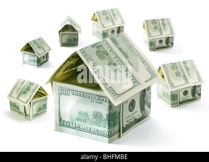 Dollar-Häuser isoliert auf weiß Stockfoto