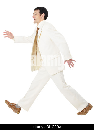 Glücklich Kaufmann in einem weißen Anzug irgendwo in Eile Stockfoto