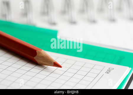 Bleistift und Notizbuch. Stockfoto