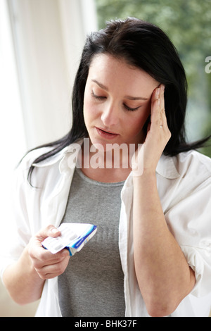 Frau mit Kopfschmerzen Stockfoto