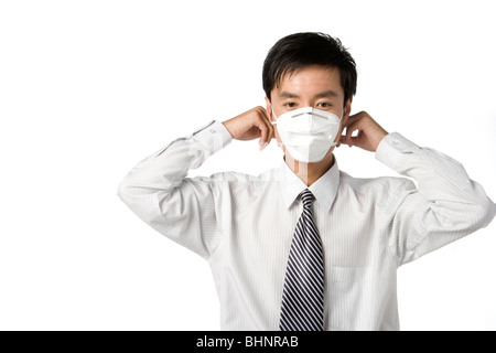 Geschäftsmann mit Maske Stockfoto