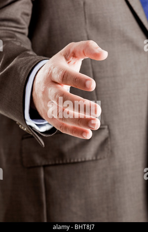 Erfolgreicher Geschäftsmann mit einem Handschlag Stockfoto