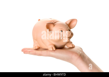 Hand mit Sparschwein und Geld Münze Stockfoto