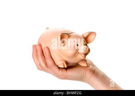 Hand mit Sparschwein und Geld Münze Stockfoto