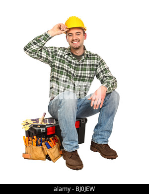 glückliche junge Arbeiter nehmen Rest sitzen in seiner toolbox Stockfoto