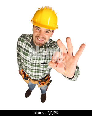 junge Handwerker lächelnd zeigen positive Einstellung, isoliert auf weiss Stockfoto