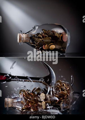 Sparschwein zerschlagen wird Stockfoto