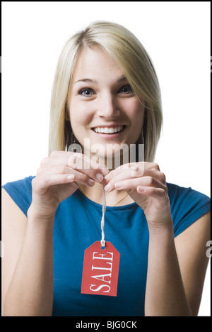 Frau mit Verkauf-tag Stockfoto