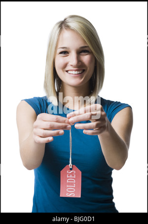 Frau mit Verkauf-tag Stockfoto