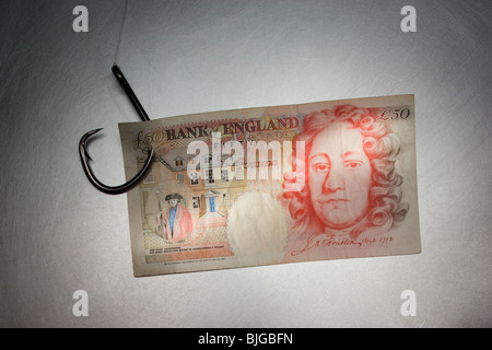 Geld auf ein Angelhaken Stockfoto