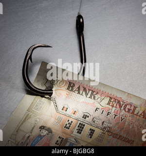 Geld auf ein Angelhaken Stockfoto