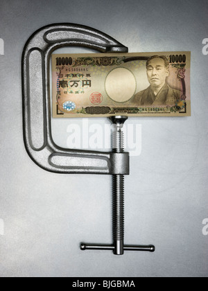 Geld in einer Klemme Stockfoto