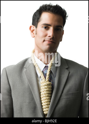 Geschäftsmann mit Schlinge des Henkers am Hals Stockfoto