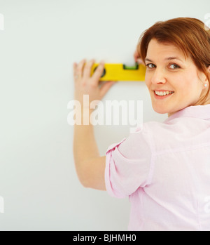 Frau mit einer Ebene Stockfoto