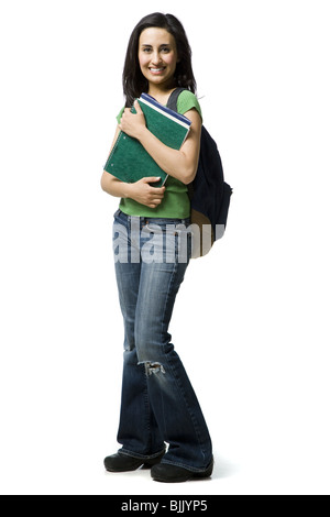 Frau mit Rucksack und Bücher lächelnd Stockfoto