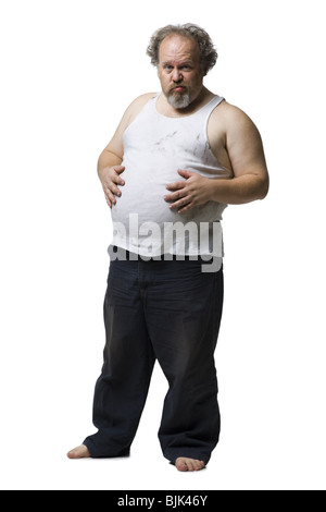 Zerzausten Mann mit den Händen auf Topfbauch Stockfoto