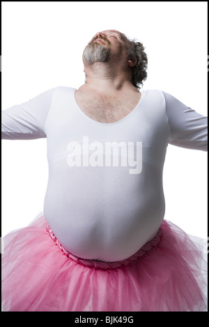 Übergewichtigen Mann im Tutu mit dem Zauberstab zu tanzen Stockfoto