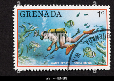 Briefmarke von Grenada Darstellung Tauchen. Stockfoto