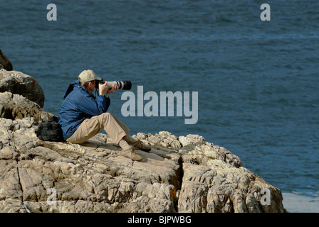 Menschen nehmen Foto einer Landschaft mit Teleobjektiv, Hermanus, South Western Cape, South Africa Stockfoto