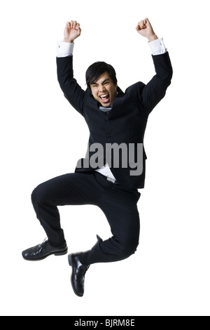 Geschäftsmann in die Luft springen Stockfoto