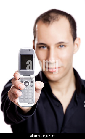 Junger Mann mit einem Handy, isoliert auf weiss Stockfoto