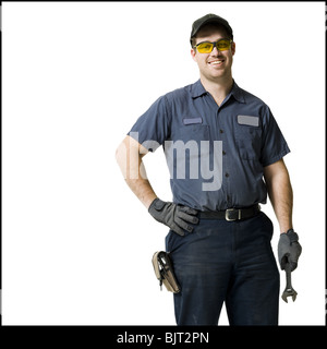 Mechaniker mit einem Schraubenschlüssel Stockfoto