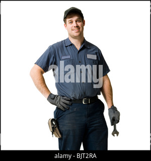 Mechaniker mit einem Schraubenschlüssel Stockfoto