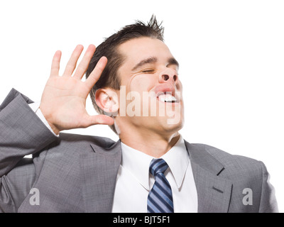 Mann mit Gesicht gedrückt gegen Fenster, Studio gedreht Stockfoto