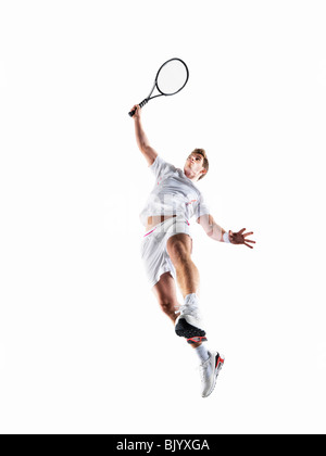 Mann mit dem Tennisspielen Stockfoto