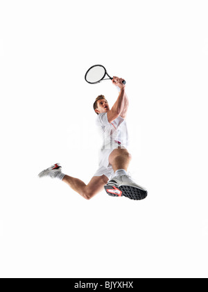 Mann mit dem Tennisspielen Stockfoto