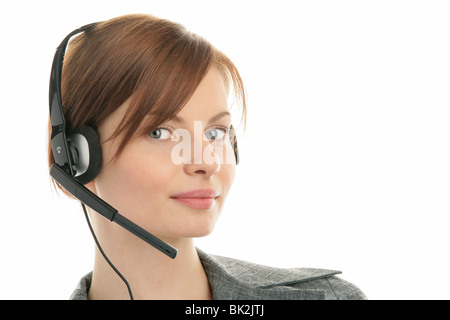 Porträt von freundlichen Sekretärin/Telefonistin tragen Kopfhörer isoliert auf weißem Hintergrund Stockfoto