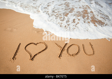 Ich liebe dich in Sand geschrieben Stockfoto