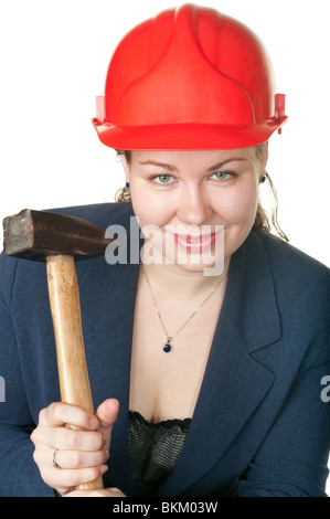 Die junge schöne Mädchen mit einem Hammer in Händen. Es ist isoliert auf weißem Hintergrund Stockfoto