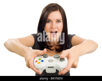 Mädchen hält eine Xbox Videospiel-Controller mit dem offenen Mund und einen überraschten Blick auf ihrem Gesicht. Stockfoto