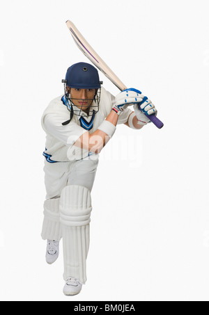 Cricket Batsman spielen einen Schuss Stockfoto