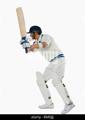 Cricket Batsman spielen einen Schuss Stockfoto