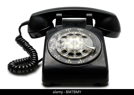 eine alte rotary schwarz Telefon auf weiß - mit Beschneidungspfad Stockfoto