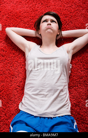 Junge Frau Sit Stockfoto