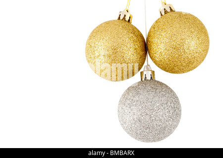 Drei Weihnachtskugeln, zwei Golden, Silber Stockfoto
