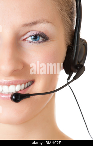 Lächelnde kaukasischen blonde Frau Berater mit Kopfhörer Stockfoto