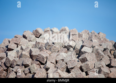 Haufen von rotem Granit Pflastersteine Stockfoto