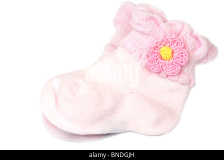 Rosa Babysocken auf weiß Stockfoto
