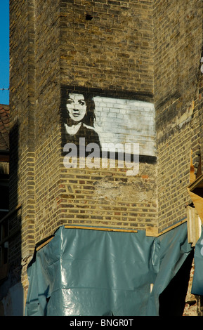 Banksy Bild an Wand in Brick Lane, East End von London Stockfoto