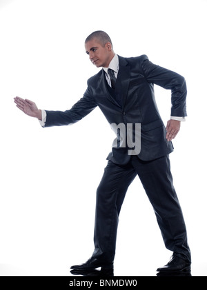 kaukasischen Mann Geschäftsmann zu Fuß Portraitstudio isoliert auf weißem Hintergrund Stockfoto