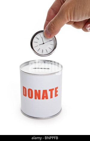 Spendenbox und Uhr, Konzept von "Zeit zu spenden" oder "Spenden Ihre Zeit". Stockfoto