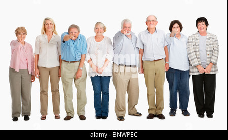 Eine Gruppe von Menschen, die in einer Reihe stehen Stockfoto