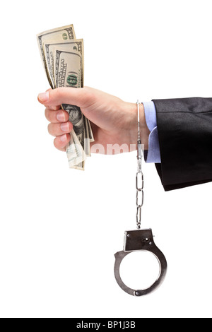 Hand mit Handschellen hält US-Dollar Stockfoto