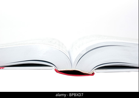 Aufgeschlagenes Buch auf dem weißen Hintergrund isoliert. Stockfoto